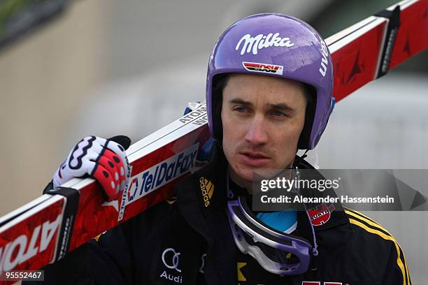 Martin Schmitt of Germany looks on after first round of the FIS Ski Jumping World Cup event of the 58th Four Hills ski jumping tournament on January...