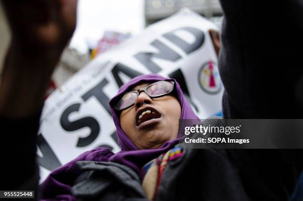 Demonstrator dances to music from a sound system on Portland Place in freezing conditions ahead of a march against racism to mark the annual...