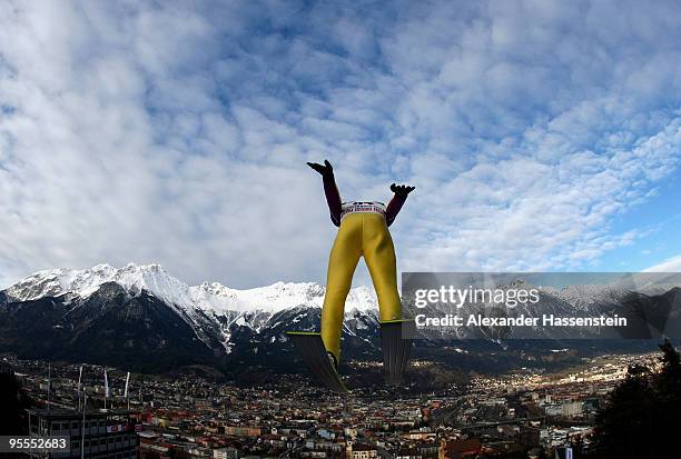 Emmanuel Chedal of France soars towards the Nordkette mountains during first round of the FIS Ski Jumping World Cup event of the 58th Four Hills ski...