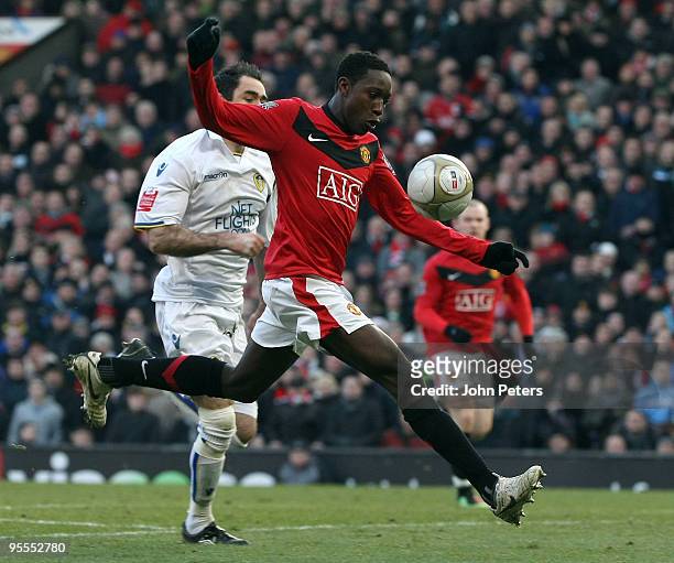 Danny Welbeck of Manchester United clashes with Andy Hughes of Leeds United during the FA Cup Sponsored by E.On Third Round match between Manchester...