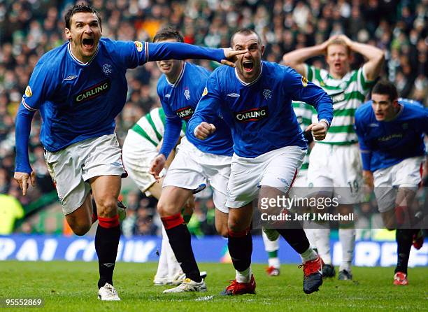 Lee McCulloch of Rangers celebrates with Kris Boyd after scoring during the Scottish Premier League match between Celtic and Rangers at Celtic Park...