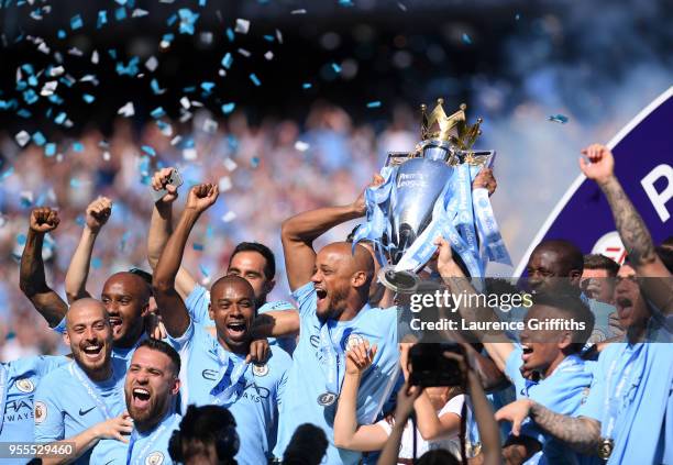 Vincent Kompany of Manchester City lifts the Premier League Trophy as Manchester City celebrate winning the Premier League Title during the Premier...