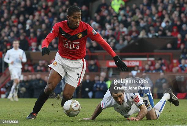 Antonio Valencia of Manchester United in action against Andy Hughes of Leeds United during the FA Cup Sponsored by E.On Third Round match between...