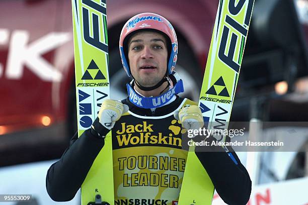 Andreas Kofler of Austria celebrates after his final jump of the FIS Ski Jumping World Cup event of the 58th Four Hills ski jumping tournament on...