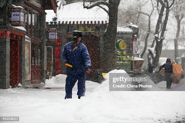 Worker clears snow at the Shichahai Lake area on January 3, 2010 in Beijing, China. The biggest snowfall in nearly 60 years blanketed Beijing today,...