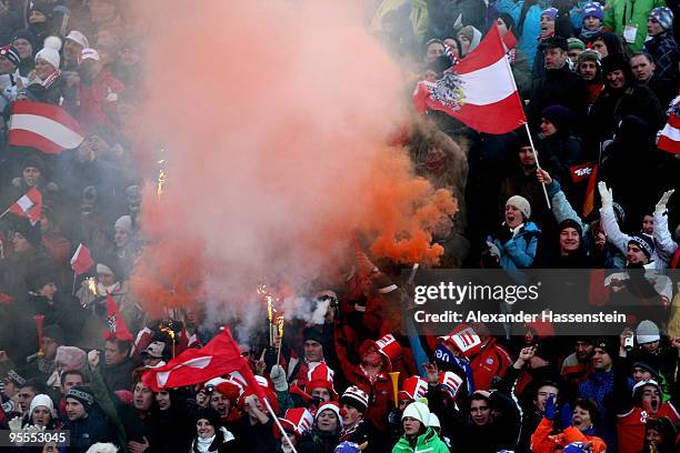 Spectators celebrates during final round of the FIS Ski Jumping World Cup event of the 58th Four Hills ski jumping tournament on January 3, 2010 in...