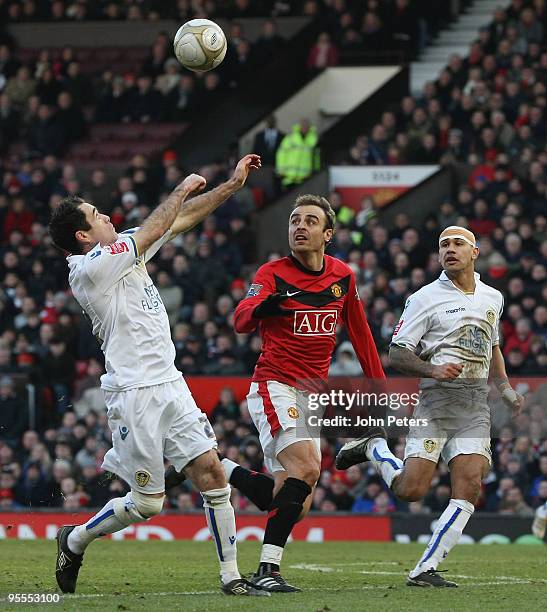 Dimitar Berbatov of Manchester United in action against Andy Hughes and Patrick Kisnorbo of Leeds United during the FA Cup Sponsored by E.On Third...