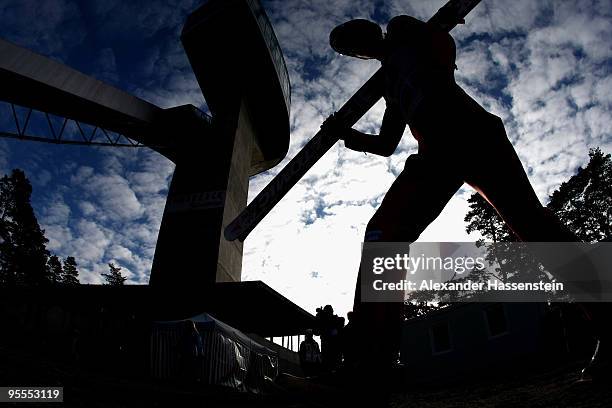 Janne Ahonen of Finland walks up the jumping hill for the final round of the FIS Ski Jumping World Cup event of the 58th Four Hills ski jumping...