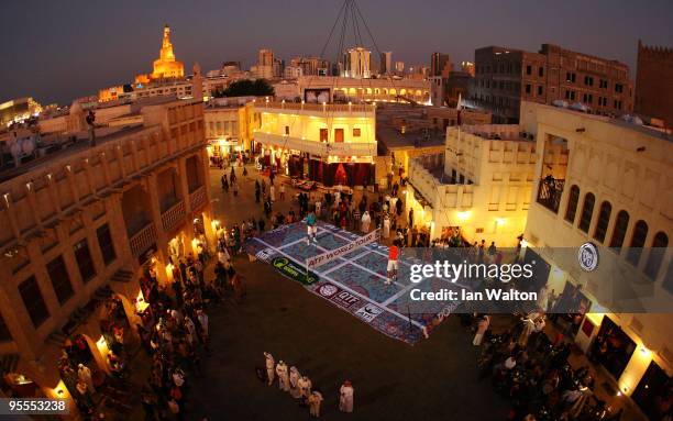 Roger Federer of Switzerland and Rafael Nadal of Spain attend a photocall to Launch the ATP Qatar ExxonMobil Open at the Souq Waqif on January 3,...