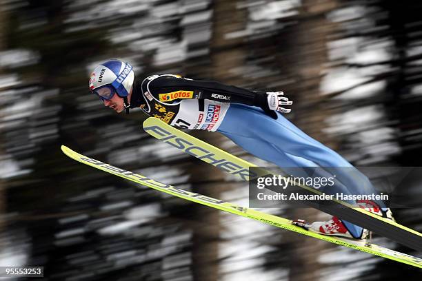 Adam Malysz of Poland competes during final round of the FIS Ski Jumping World Cup event of the 58th Four Hills ski jumping tournament on January 3,...