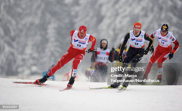 Bill Demong of the USA, Bjoern Kircheisen of Germany and Felix Gottwald of Austria compete in the Gundersen 10km Cross Country event during day two...