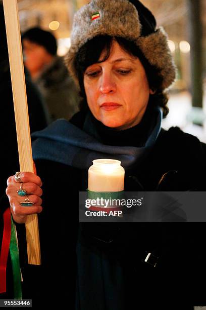 Protesters hold a candle-light vigil on January 2, 2010 in Berlin to commemorate the victims of recent demonstrations in Iran. Iranian opposition...