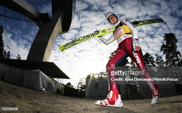 Simon Ammann of Switzerland walks up the jumping hill for the final round of the FIS Ski Jumping World Cup event of the 58th Four Hills ski jumping...