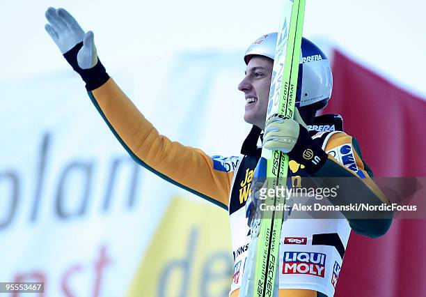Gregor Schlierenzauer of Austria celebrates winning after his final jump of the FIS Ski Jumping World Cup event of the 58th Four Hills ski jumping...