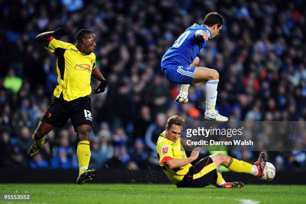 Joe Cole of Chelsea is tackled by John Eustace and Lloyd Doyley of Watford during the FA Cup sponsored by E.ON Final 3rd round match between Chelsea...