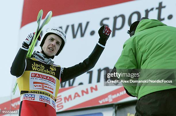 Simon Ammann of Switzerland celebrates after taking second place in the FIS Ski Jumping World Cup event of the 58th Four Hills ski jumping tournament...