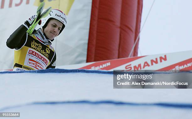 Simon Ammann of Switzerland reacts after taking second place in the FIS Ski Jumping World Cup event of the 58th Four Hills ski jumping tournament on...