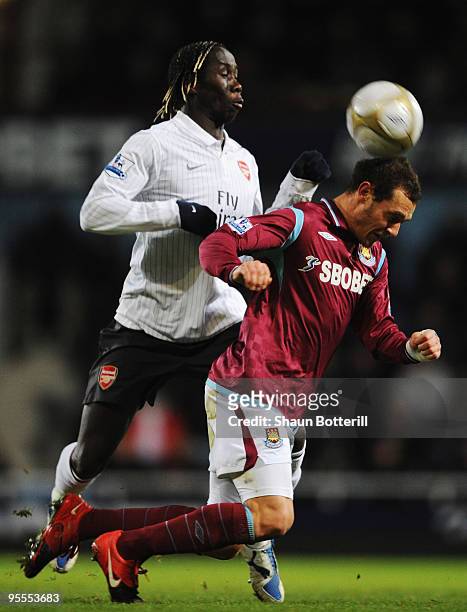 Alessandro Diamanti of West Ham United is tackled by Bacary Sagna of Arsenal during the FA Cup sponsored by E.ON 3rd Round match between West Ham...