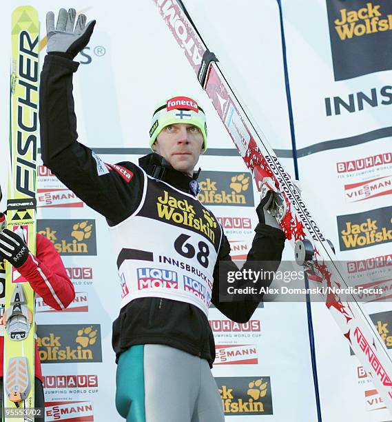 Janne Ahonen of Finland celebrates on the podium after taking third place in the FIS Ski Jumping World Cup event of the 58th Four Hills ski jumping...