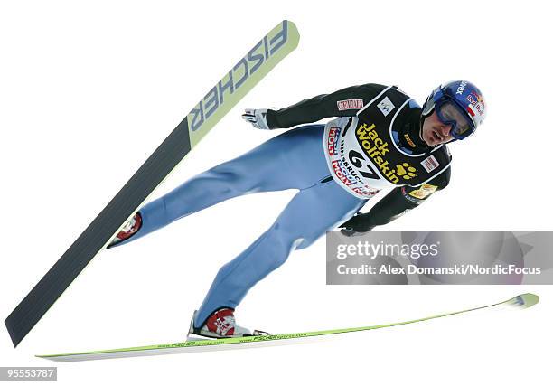 Adam Malysz of Poland competes during the FIS Ski Jumping World Cup event of the 58th Four Hills ski jumping tournament on January 3, 2010 in...