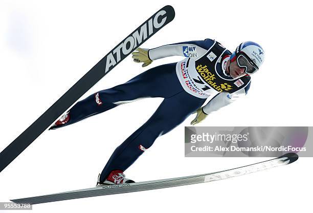 Wolfgang Loitzl of Austria competes during the FIS Ski Jumping World Cup event of the 58th Four Hills ski jumping tournament on January 3, 2010 in...