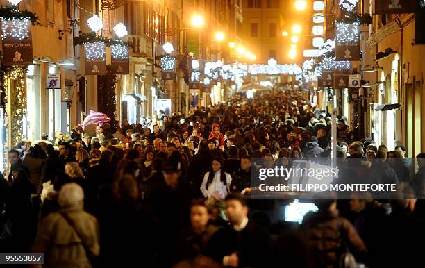 People walk near Via Condotti, one of central Rome's main shopping streets, for the second day of sales, on January 3, 2010. Thousands of Roman and...