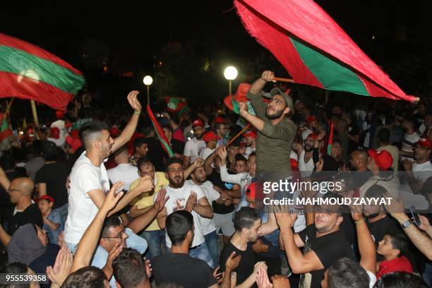 Supporters of Oussama Saad celebrate his victory in the general elections, in Sidon, on May 6, 2018. - Less than half of Lebanon's electorate voted...