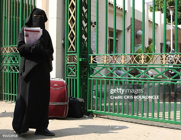 -- File picture dated October 7, 2009 shows conservative Cairo University student wearing the niqab, a black veil which covers the face except for...