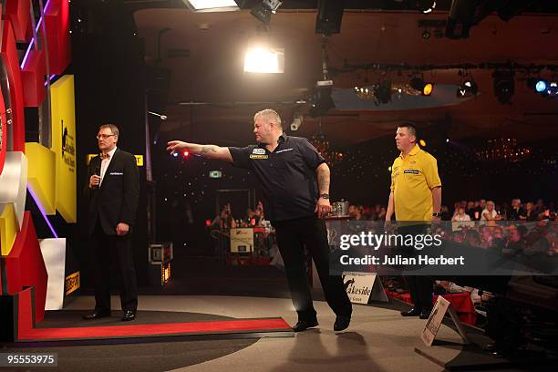 Darryl Fitton of England in action against Dave Chisnall of England during the World Professional Darts Championship 1st Round Match played at The...