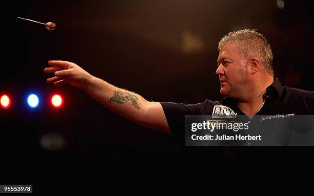 Darryl Fitton of England in action against Dave Chisnall of England during the World Professional Darts Championship 1st Round Match played at The...