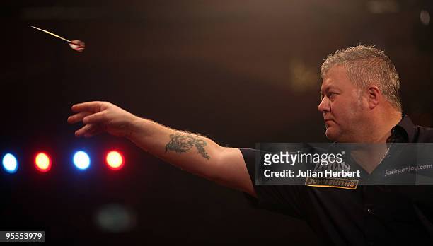 Darryl Fitton of England in action against Dave Chisnall of England during the World Professional Darts Championship 1st Round Match played at The...