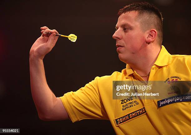 Dave Chisnall of England in action against Darryl Fitton of England during the World Professional Darts Championship 1st Round Match played at The...