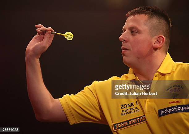 Dave Chisnall of England in action against Darryl Fitton of England during the World Professional Darts Championship 1st Round Match played at The...