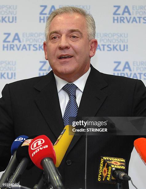Croatia's former prime minister Ivo Sanader gestures as he addresses journalists at his party's headquarters in capital Zagreb on January 3, 2010....