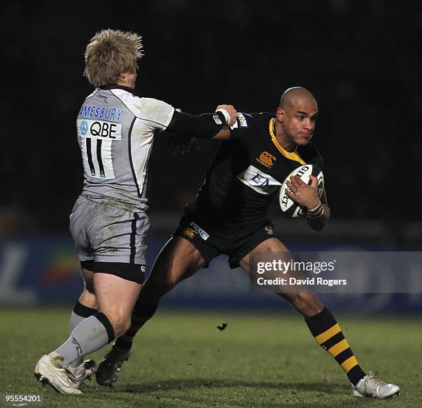 Tom Varndell of Wasps is tackled by Charlie Amesbury during the Guinness Premiership match between London Wasps and Newcastle Falcons at Adams Park...