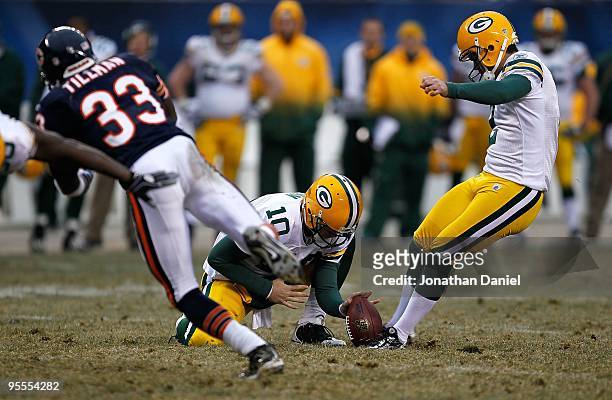Charles Tillman of the Chicago Bears tries to block a field goal attempt by Mason Crosby of the Green Bay Packers out of the hold of Matt Flynn at...