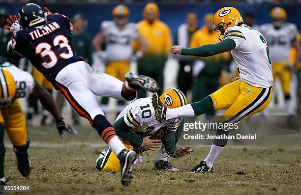 Charles Tillman of the Chicago Bears tries to block a field goal attempt by Mason Crosby of the Green Bay Packers out of the hold of Matt Flynn at...