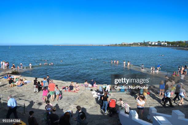 View of crowded costline near Seapoint Martello tower as temperatures remain over 20C during May Bank Holiday weekend. On Sunday, May 6 in Dublin,...