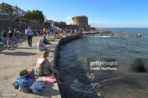 View of crowded costline near Seapoint Martello tower as temperatures remain over 20C during May Bank Holiday weekend. On Sunday, May 6 in Dublin,...