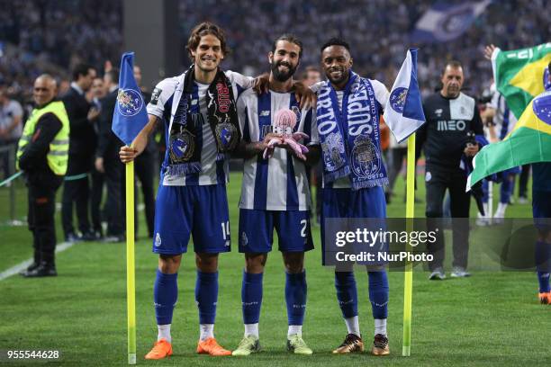 Porto's Portuguese forward Goncalo Paciencia , Porto's Portuguese midfielder Sergio Oliveira and Porto's Portuguese forward Hernani celebrates the...