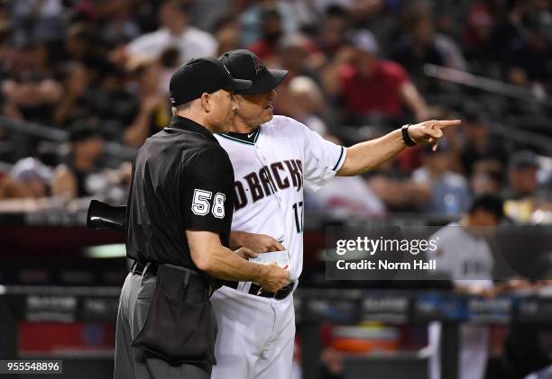 Manager Torey Lovullo of the Arizona Diamondbacks talks with home plate umpire Dan Iassogna during the ninth inning against the Houston Astros at...