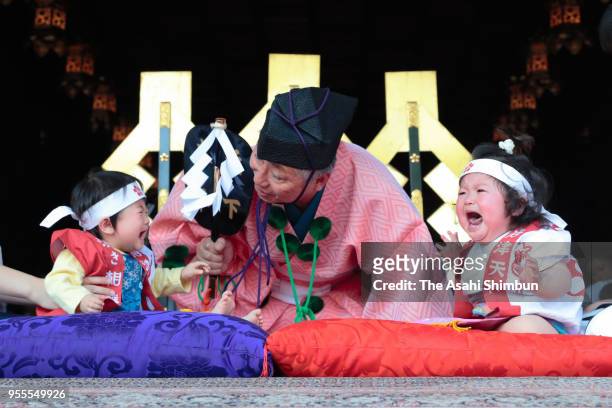 Babies cry during the Nakizumo or baby cry sumo contest at Iwazu Tenmangu Shrine on May 5, 2018 in Okazaki, Aichi, Japan. Babies compete crying at...