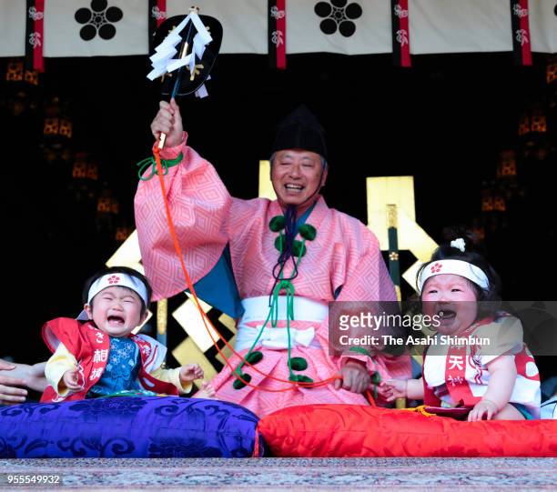 Babies cry during the Nakizumo or baby cry sumo contest at Iwazu Tenmangu Shrine on May 5, 2018 in Okazaki, Aichi, Japan. Babies compete crying at...