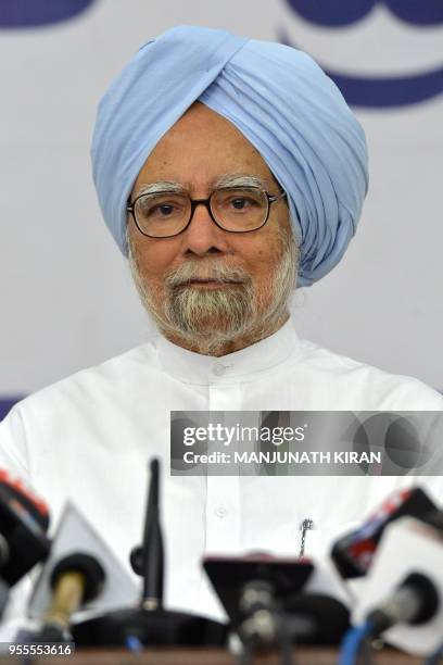 Former Indian prime pinister and veteran Congress leader Manmohan Singh addresses a press conference at the Karnataka Pradesh Congress Committee...