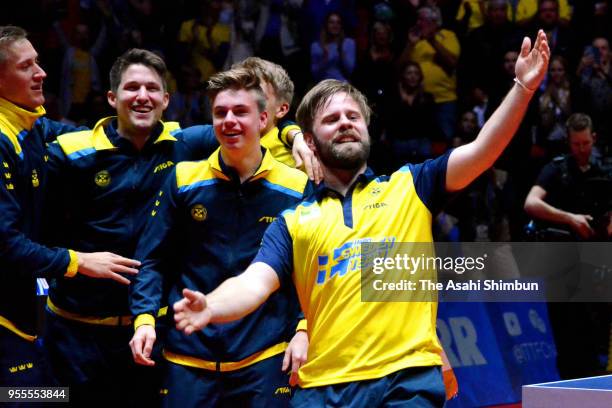 Sweden players celebrate after winning the Men's quarter final against England on day six of the World Team Table Tennis Championships at Halmstad...