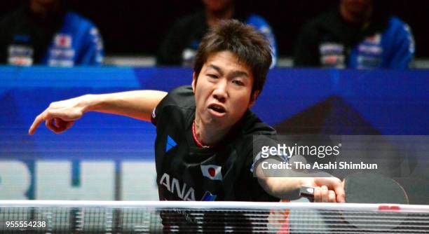 Jun Mizutani of Japan competes against Lee Sangsu of South Korea in the Men's quarter final on day six of the World Team Table Tennis Championships...