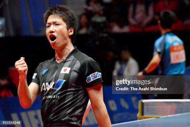 Jun Mizutani of Japan celebrates a point against Lee Sangsu of South Korea in the Men's quarter final on day six of the World Team Table Tennis...