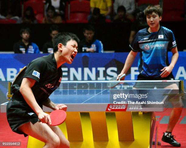 Tomokazu Harimoto of Japan celebrates a point against Jeoung Youngsik of South Korea in the Men's quarter final on day six of the World Team Table...