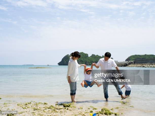 the family playing on the beach - japan beach foto e immagini stock
