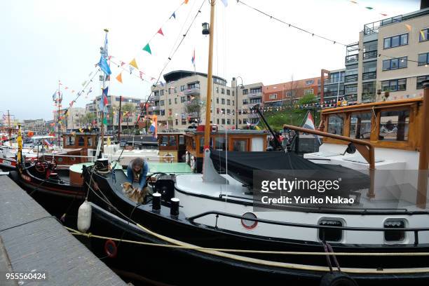 Boats are anchored at a harbour during a celebration of the Koningsdag or the King's day April 27 in Katwijk, Netherlands. King's day is ta national...